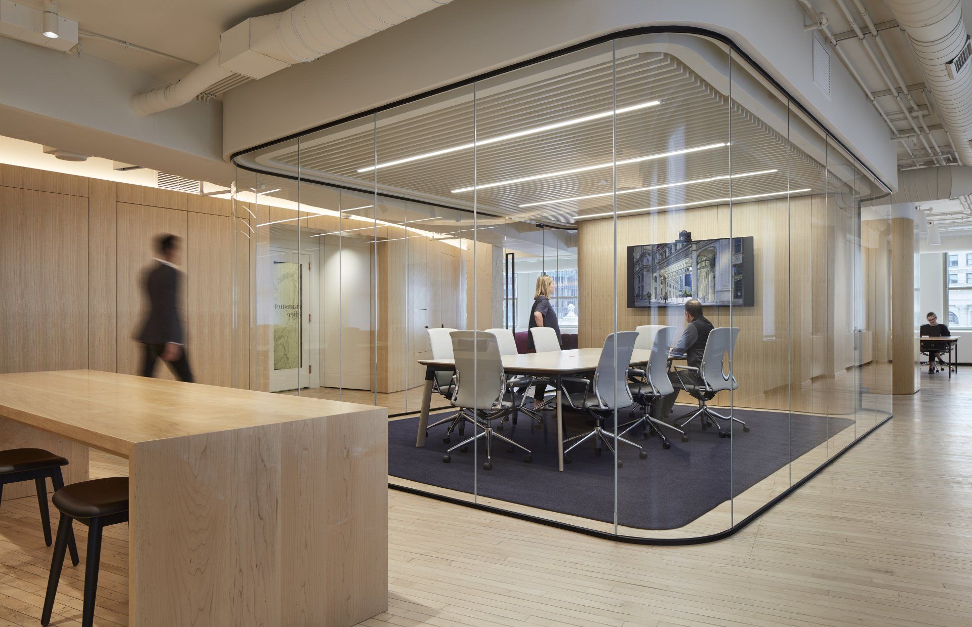 A conference room with a table and chairs in it.