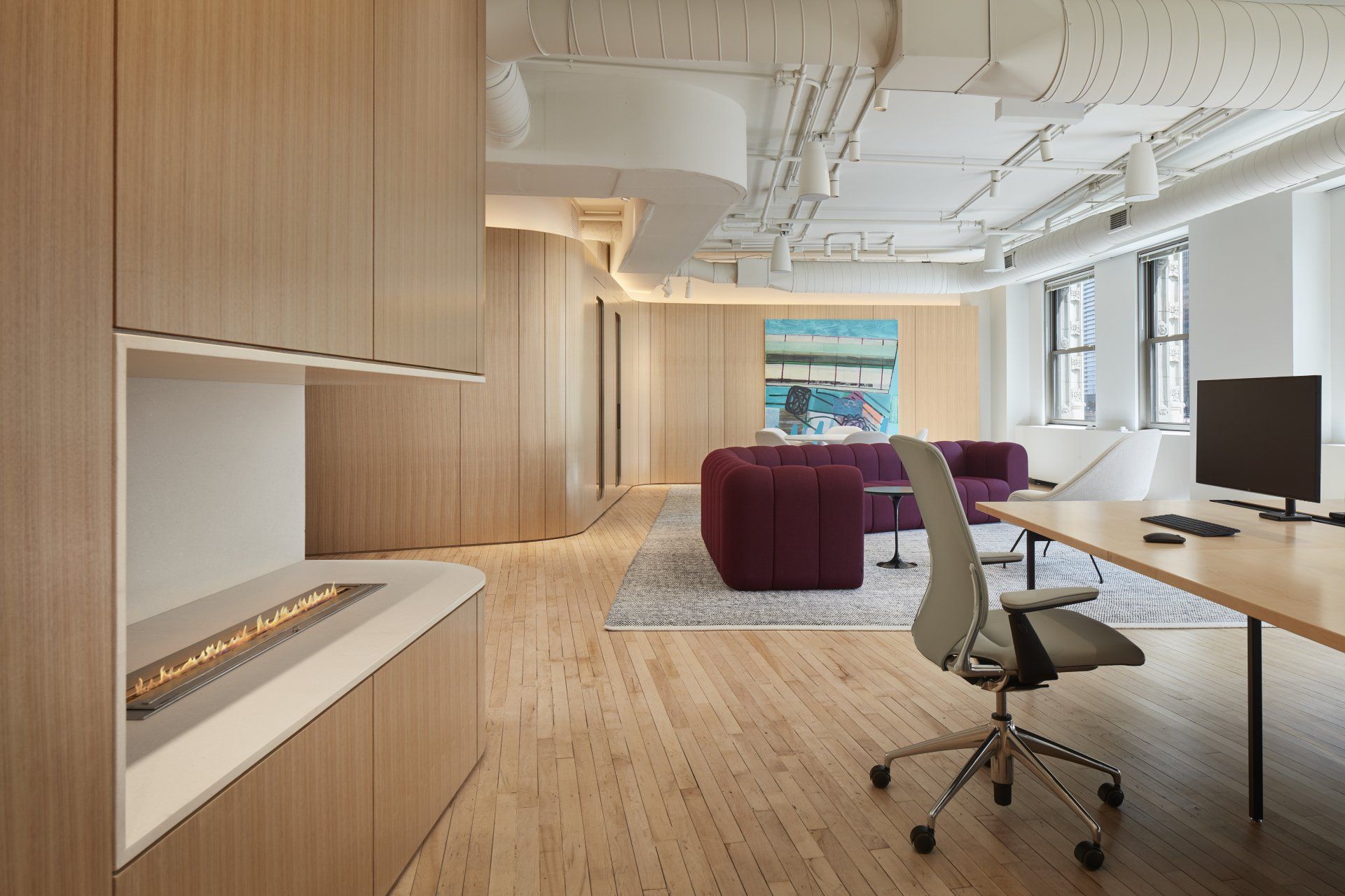 There is a fireplace in the corner of the room.