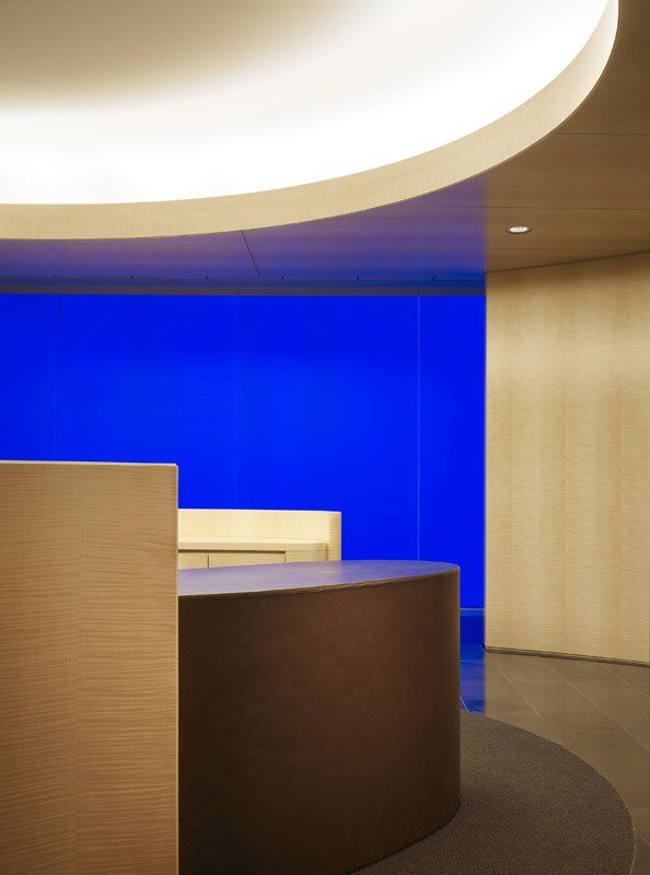 A room with a blue wall and a round table