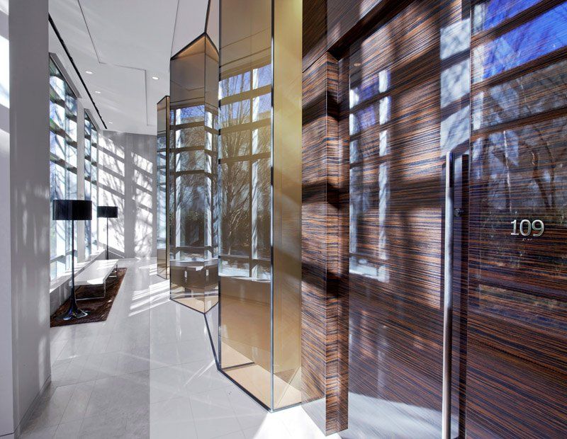 A hallway with a glass door that says 109 on it