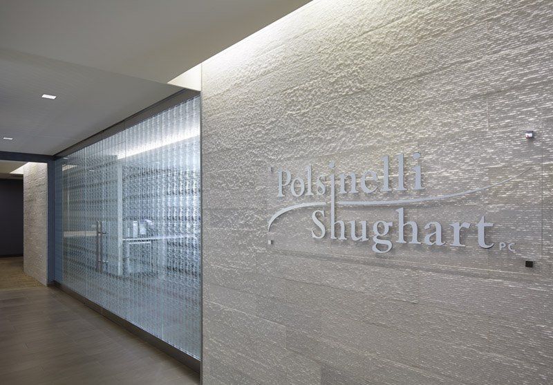 A hallway with a sign on the wall that says slughart