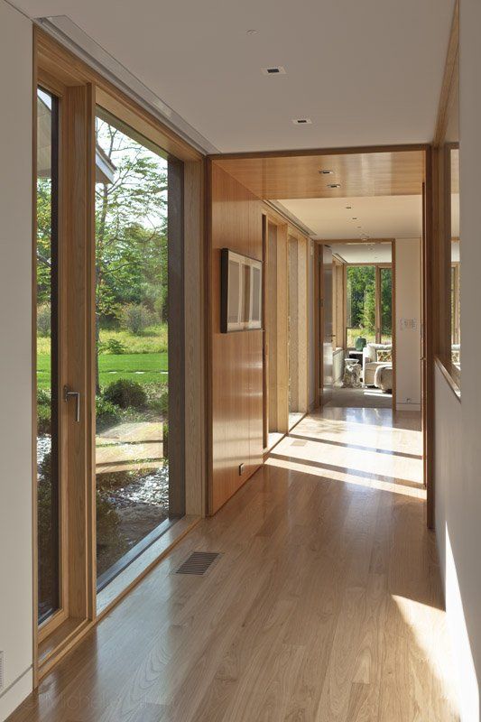 A hallway in a house with a lot of windows