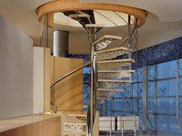 There is a spiral staircase in the middle of the room.