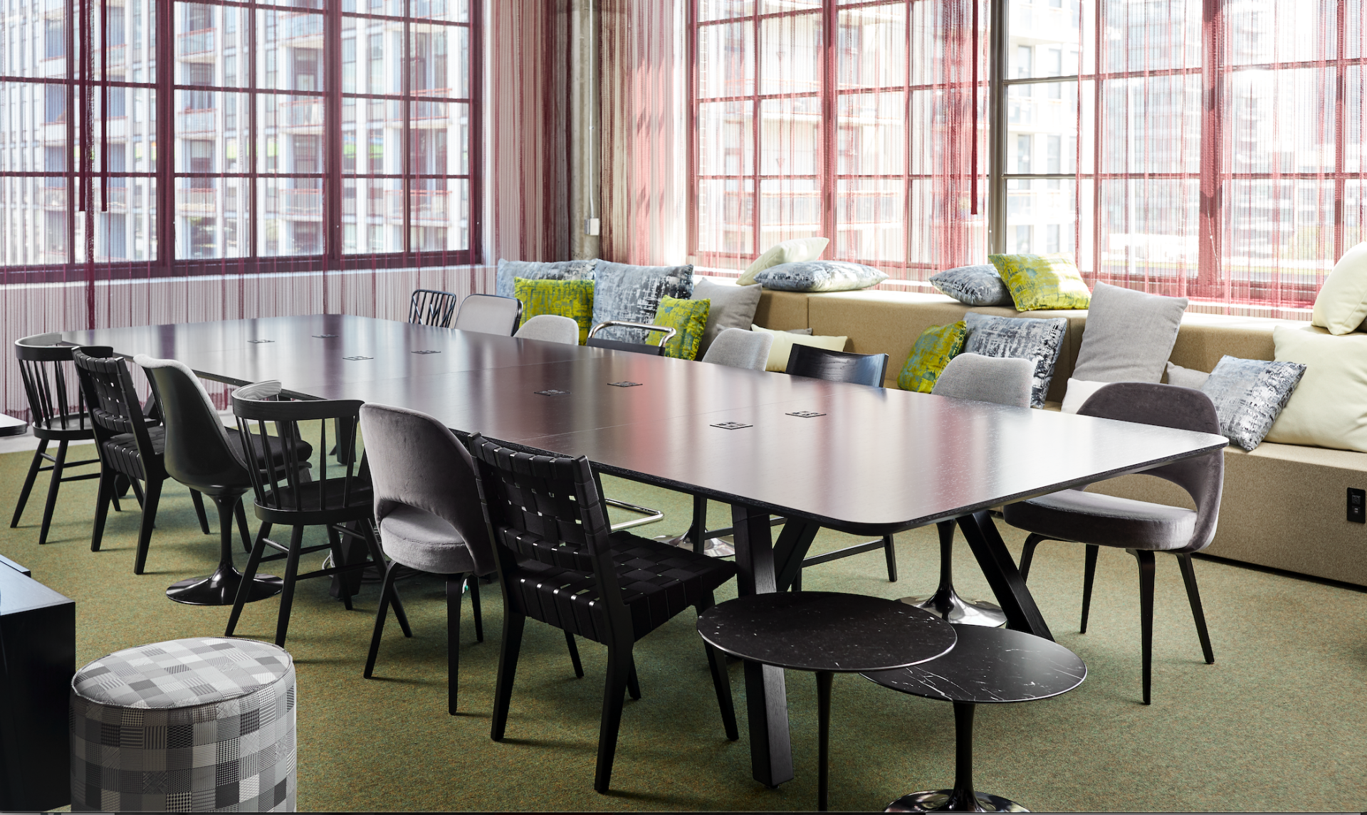 A conference room with a long table and chairs