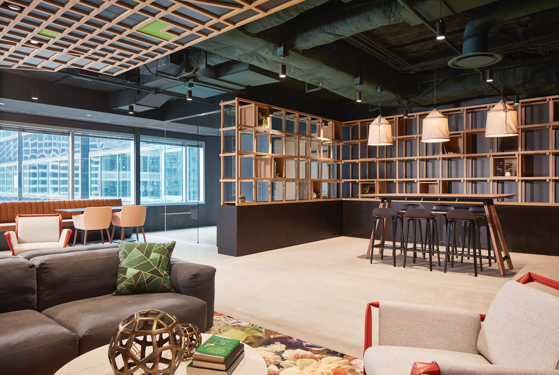 A living room with a couch , chairs , and a table.