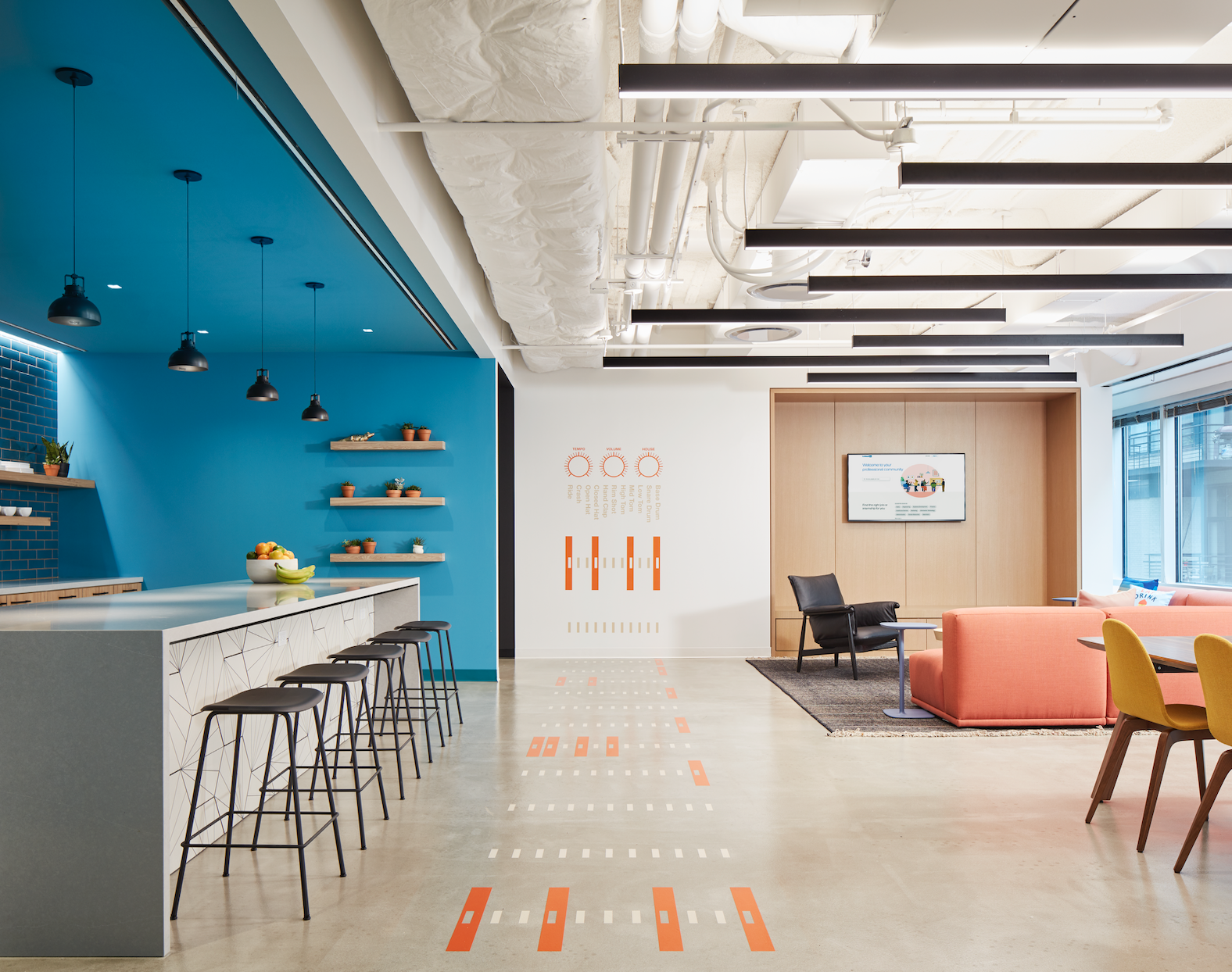 A living room with a blue wall and a white counter