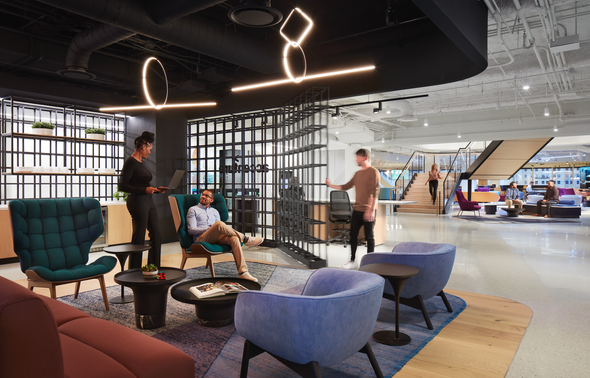 A group of people are sitting in chairs in a living room.