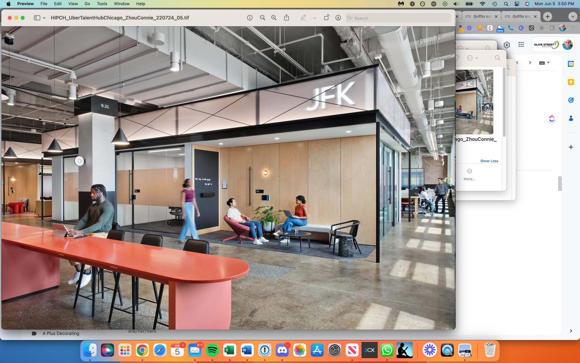 A computer screen shows a rendering of a building with a sign that says jfk
