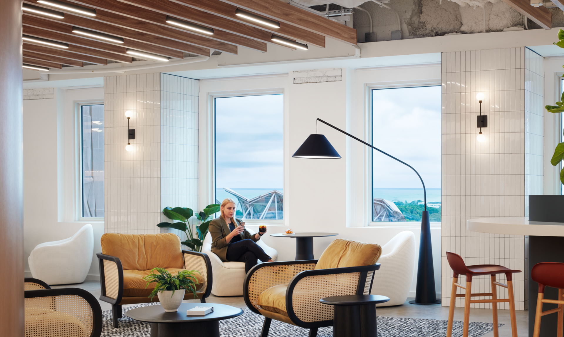 A woman is sitting in a chair in a living room.
