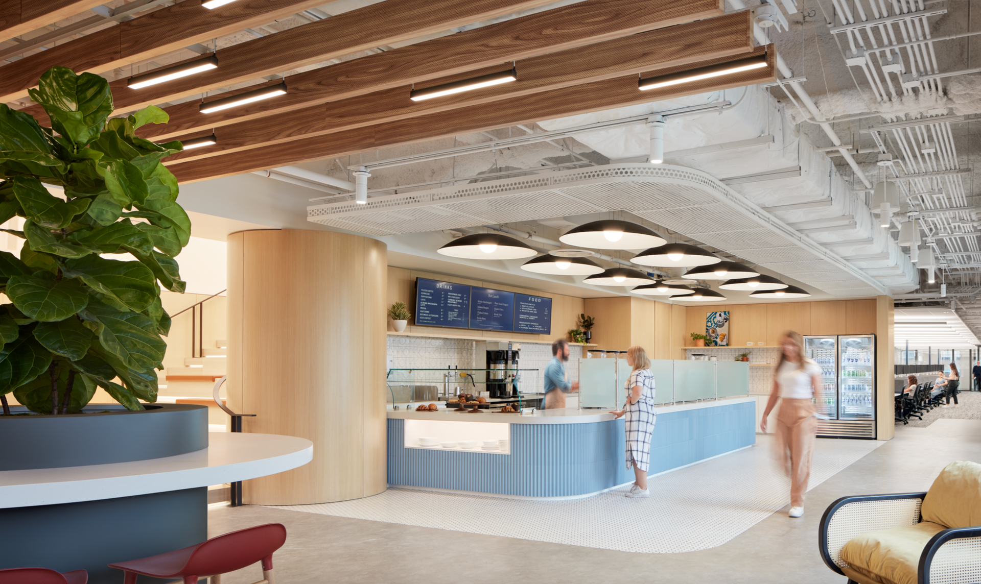 A woman is walking towards a counter in a restaurant.