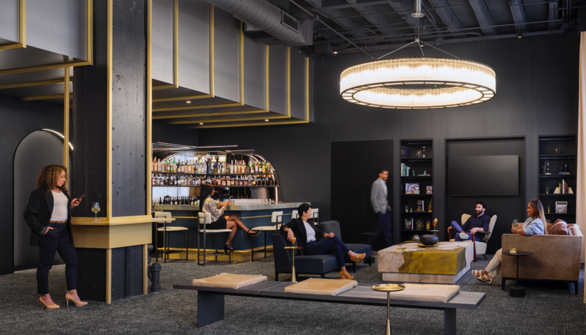 A woman is standing in a room with a lot of furniture.