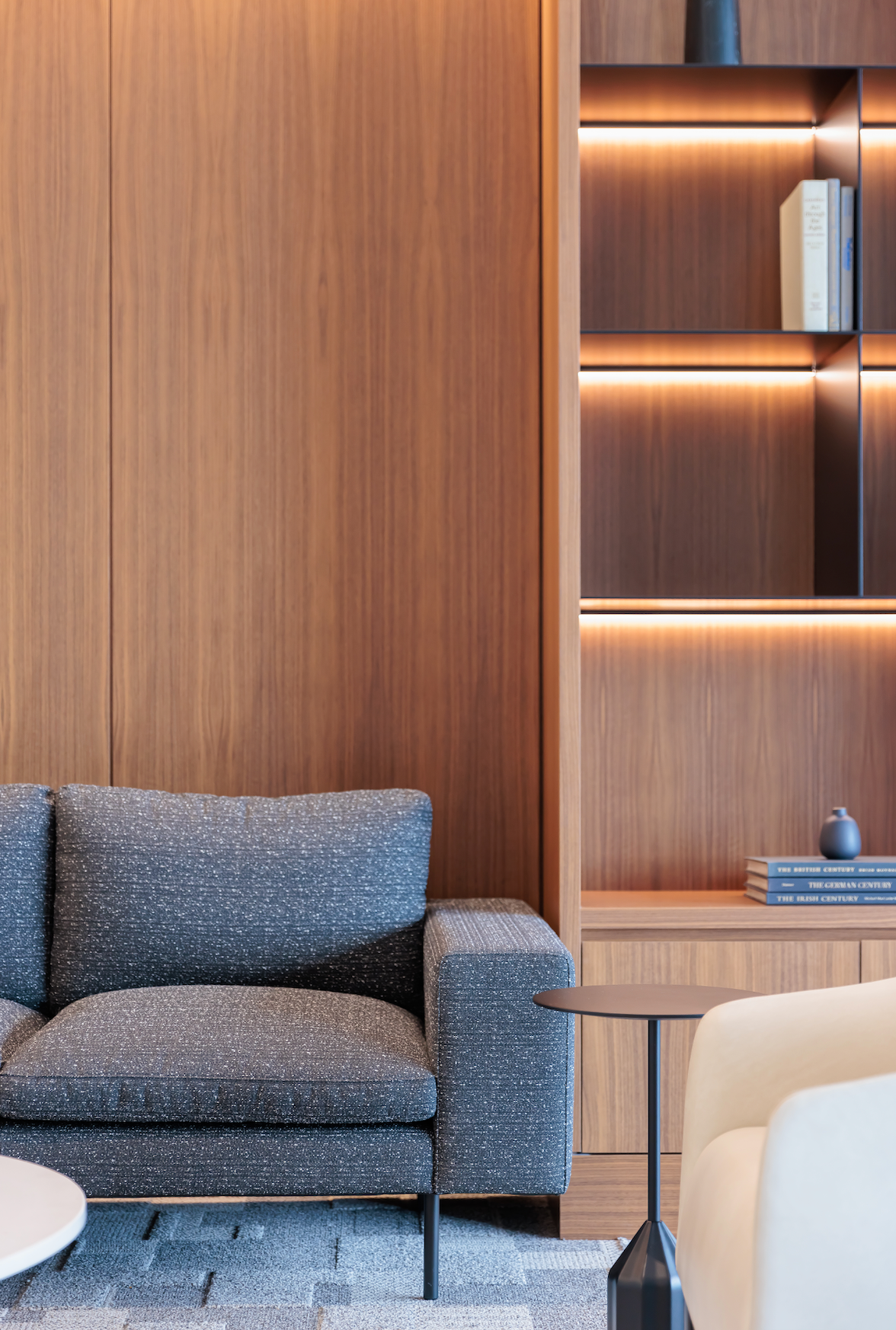 There is a couch and a chair in the living room.