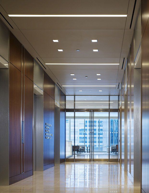 A hallway with a sign that says ' elevator ' on it