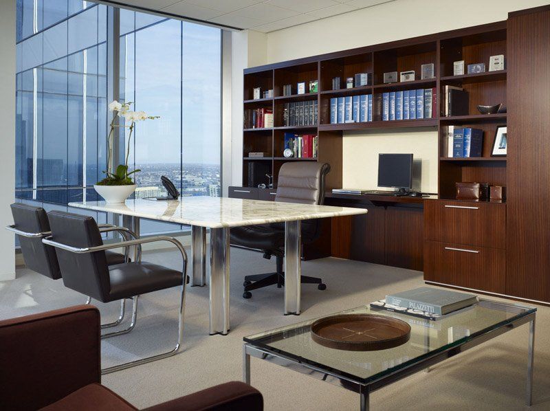A conference room with a table and chairs and a coffee table