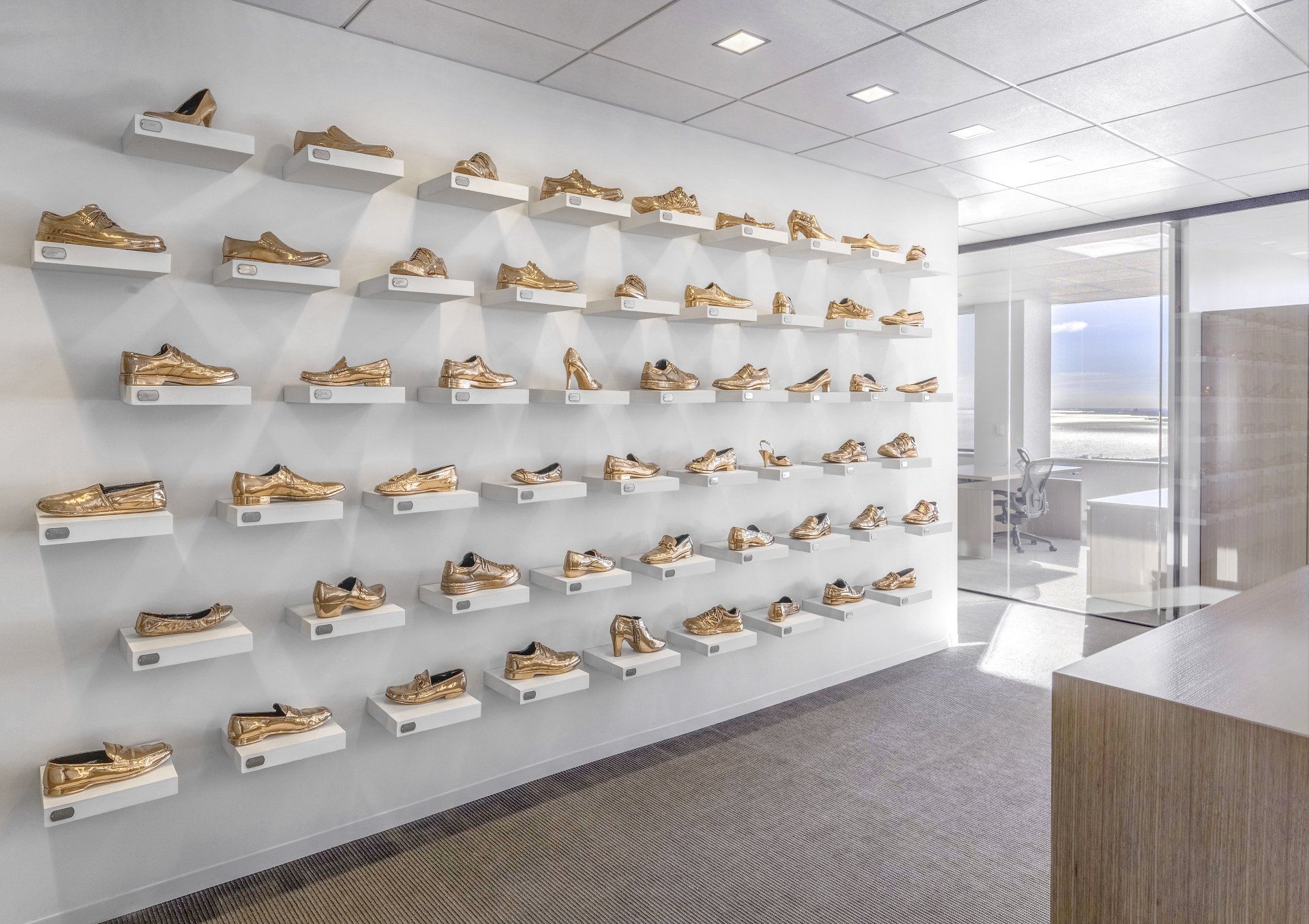 A wall with a lot of shoes on it