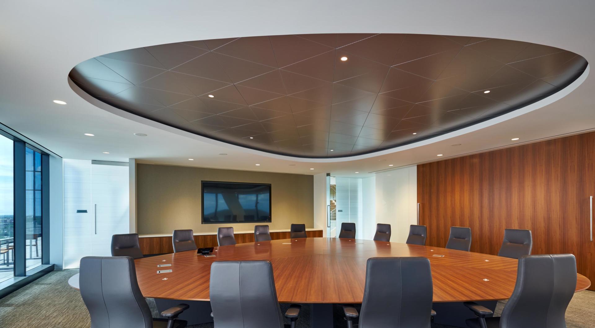 A conference room with a large table and chairs