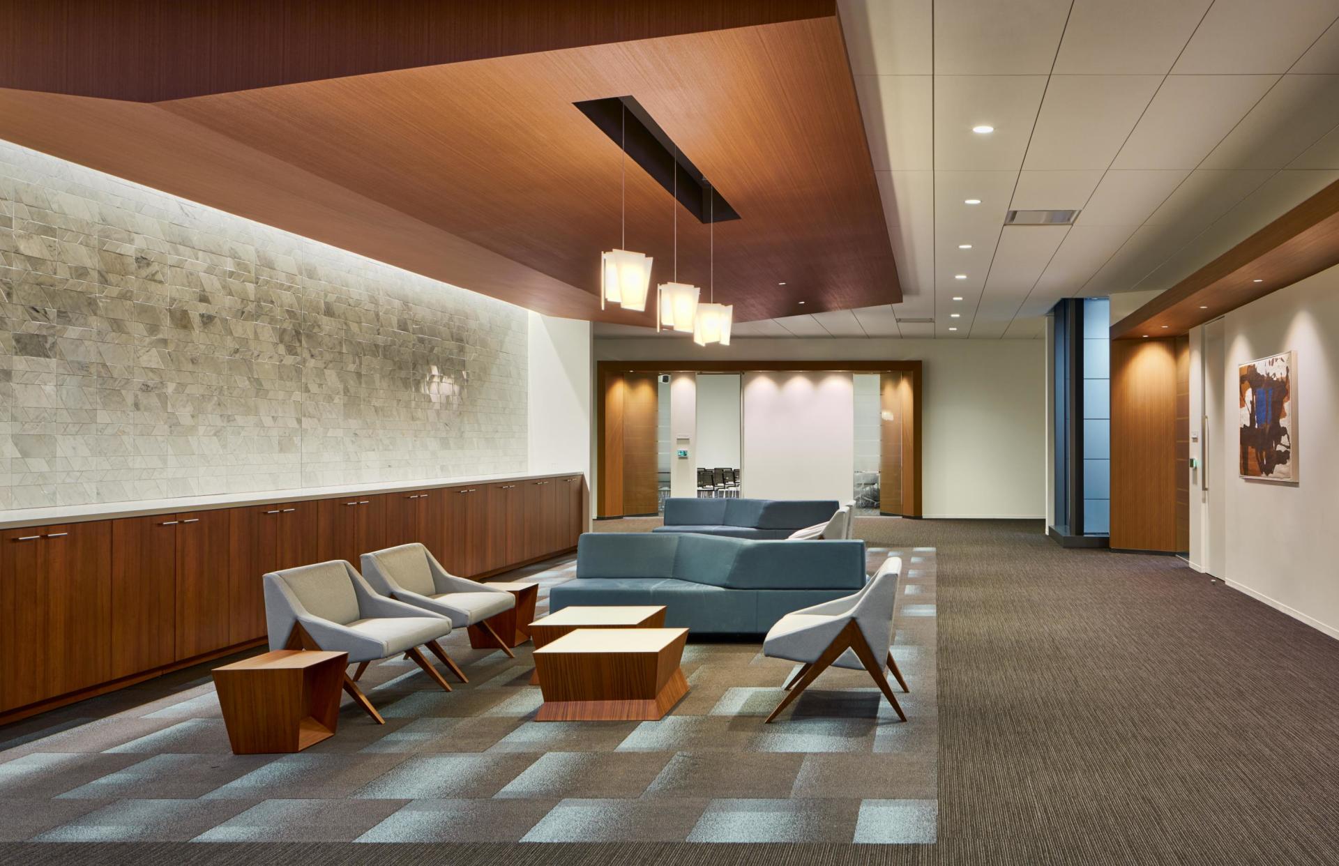 A living room with a couch and chairs in it