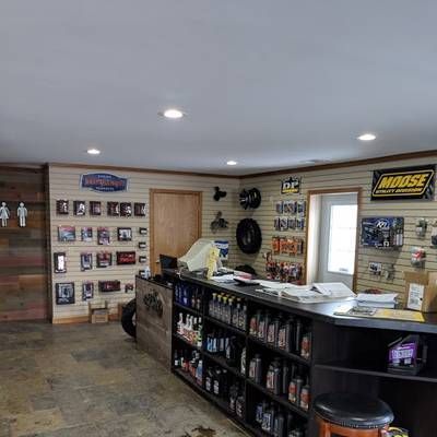 A store filled with lots of shelves and a counter.