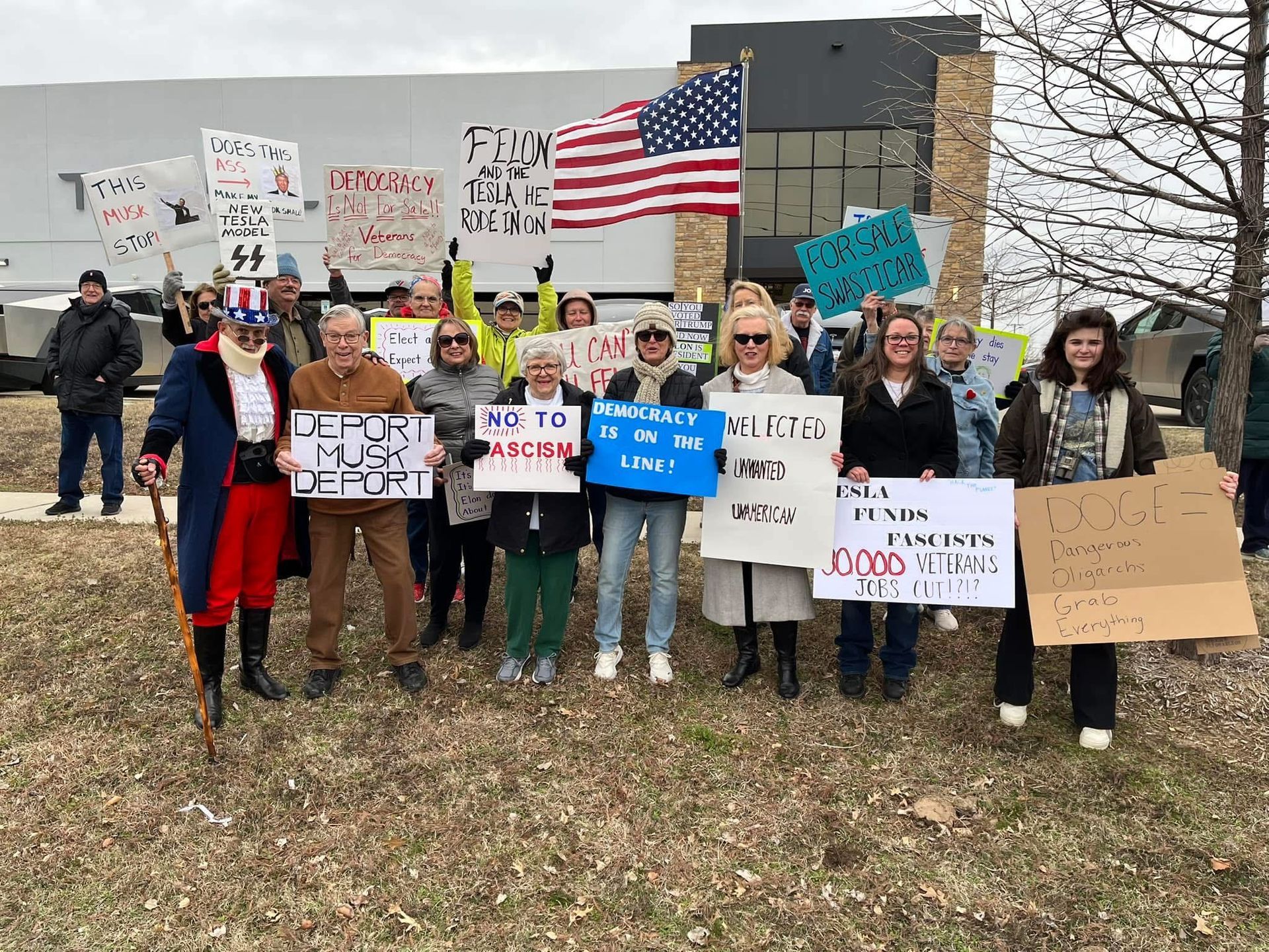 Many of our members protested at the Tesla dealership in March. 