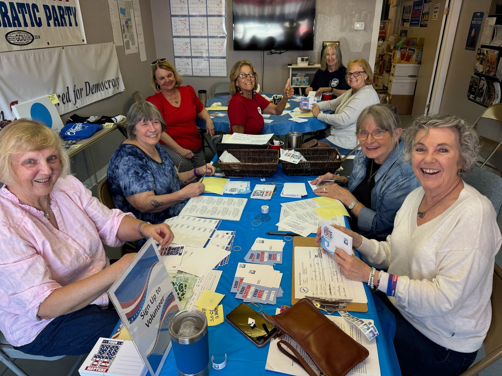 WE members work on a postcard mailing