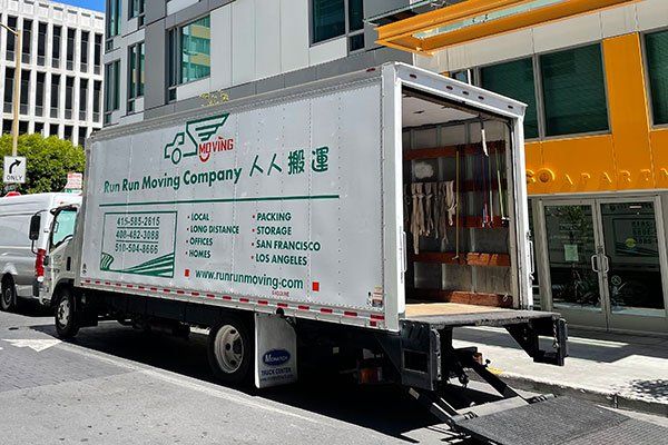 An aerial view of a dock filled with lots of containers.