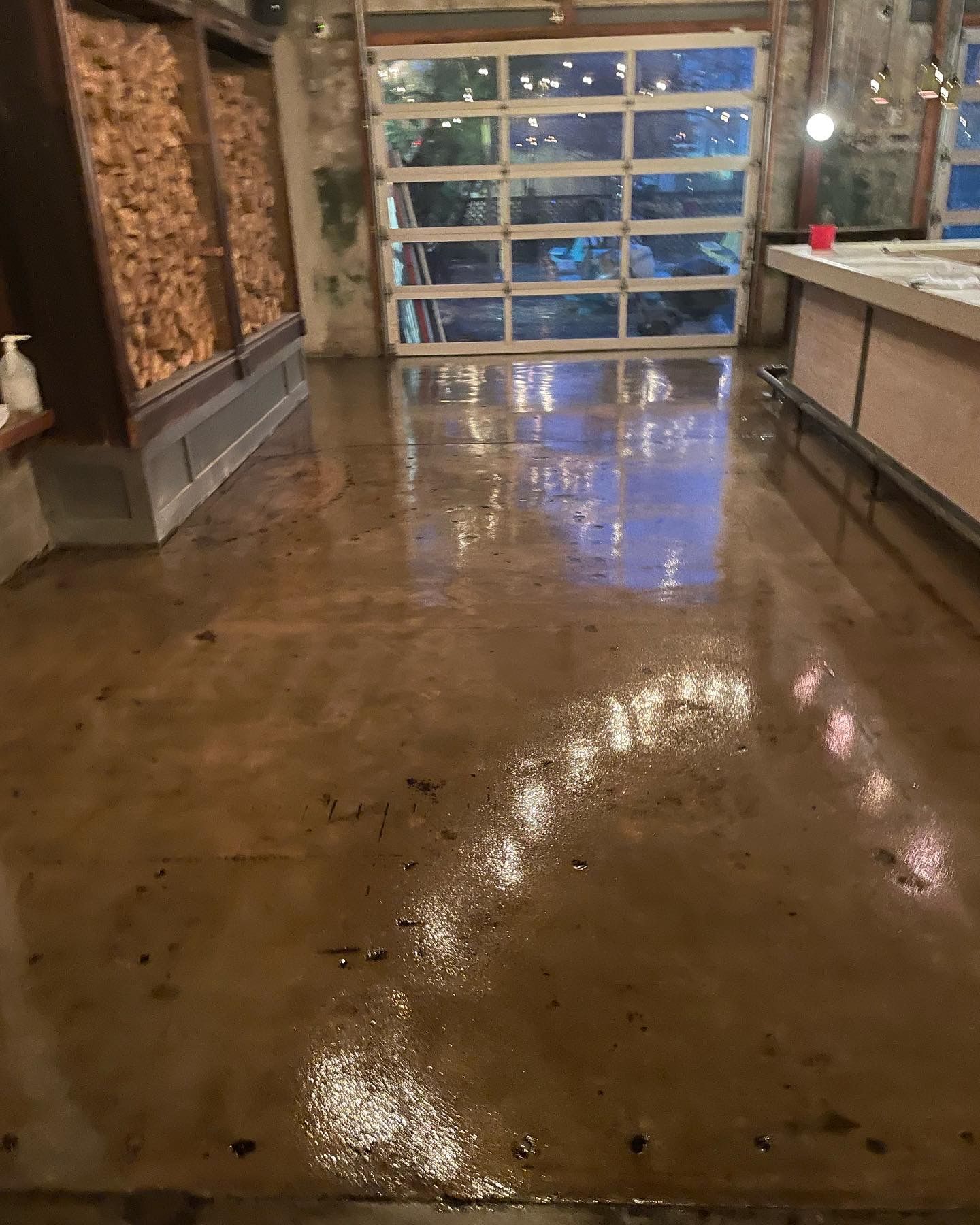 A close up of a painting of a river with a reflection of a mountain in the water.