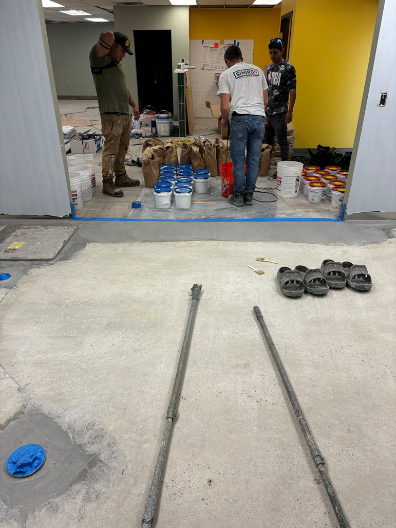 A close up of a painting of a river with a reflection of a mountain in the water.