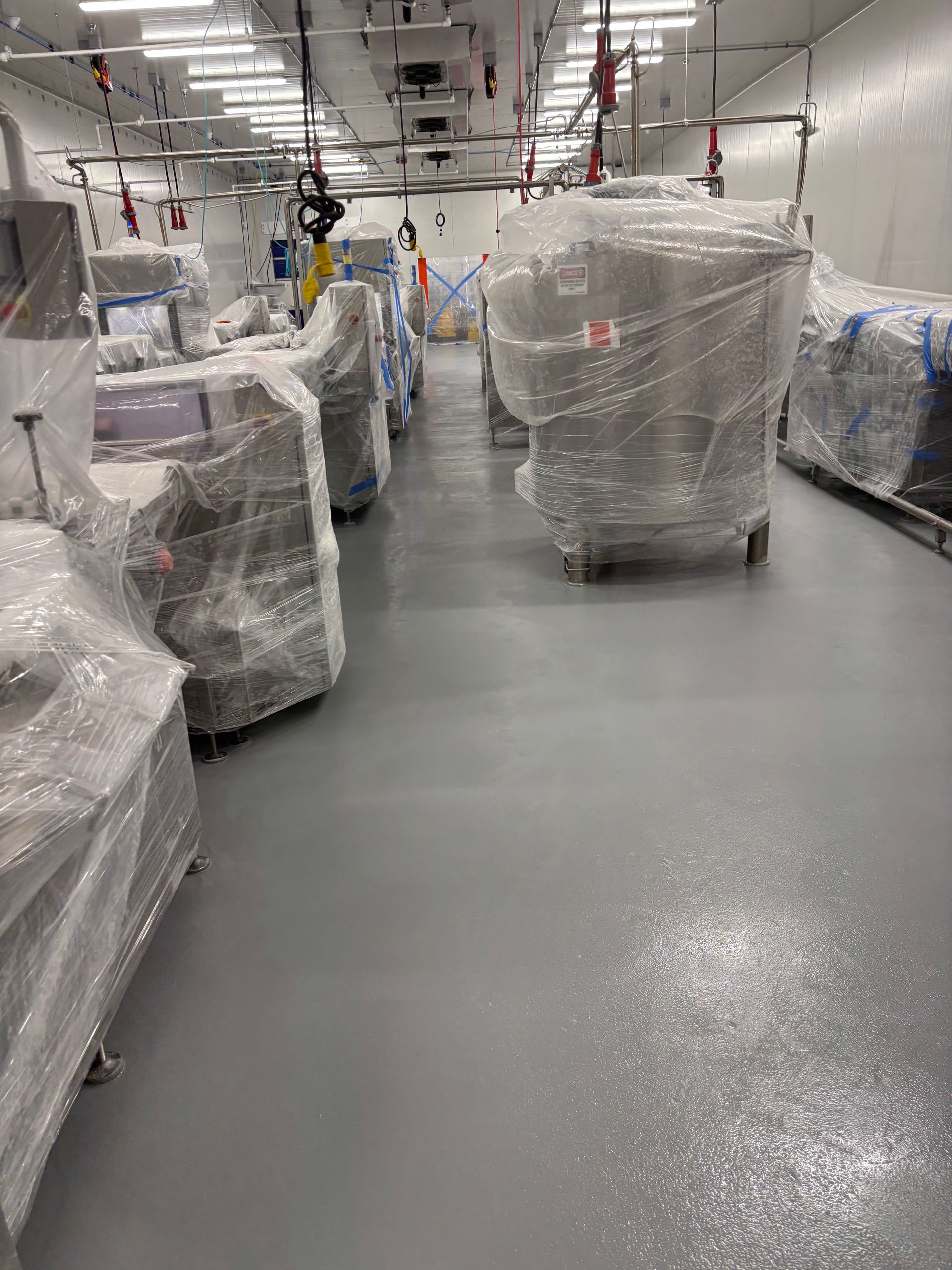 A close up of a cracked concrete surface.