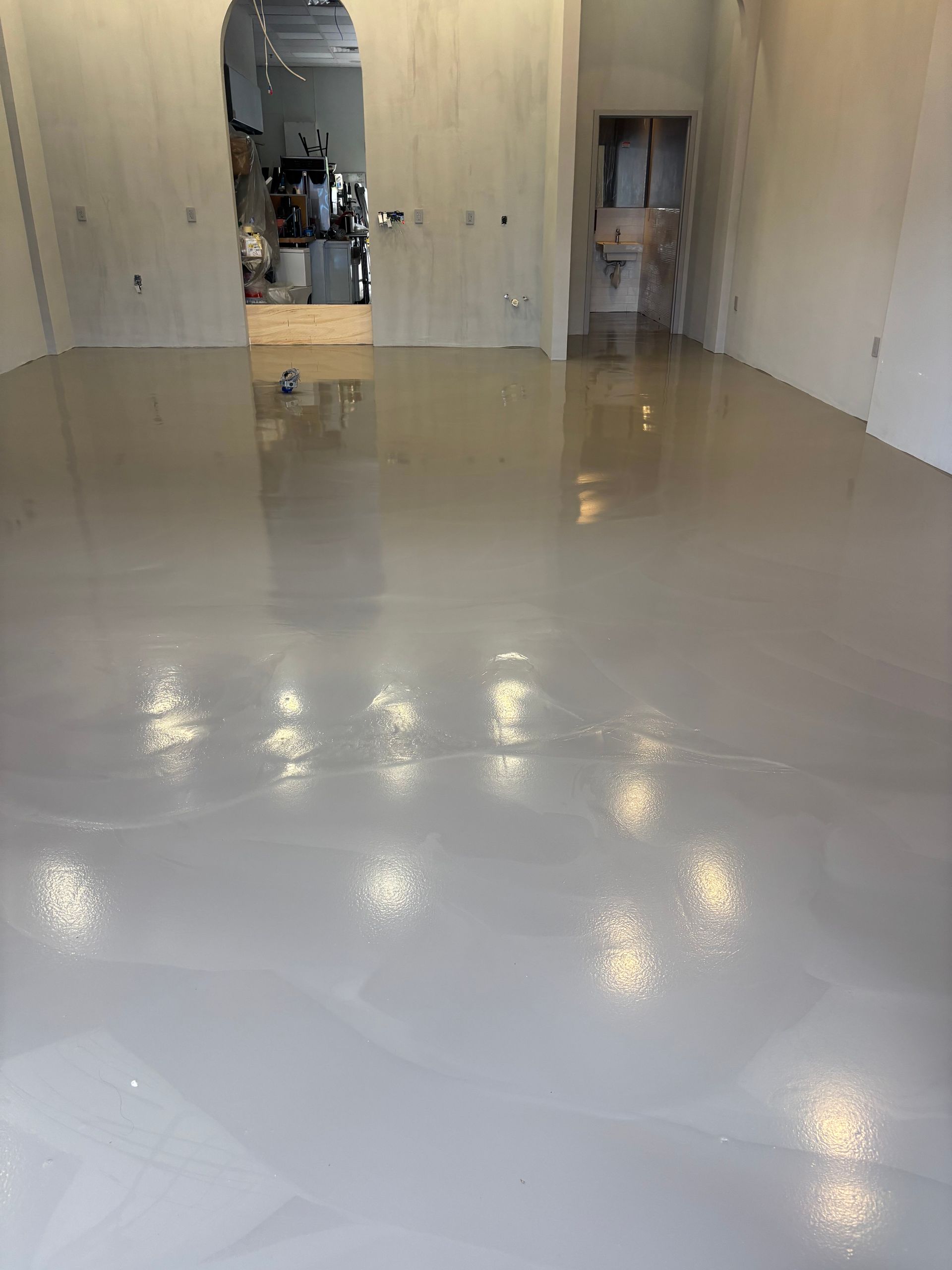A large room with a white floor and white walls.