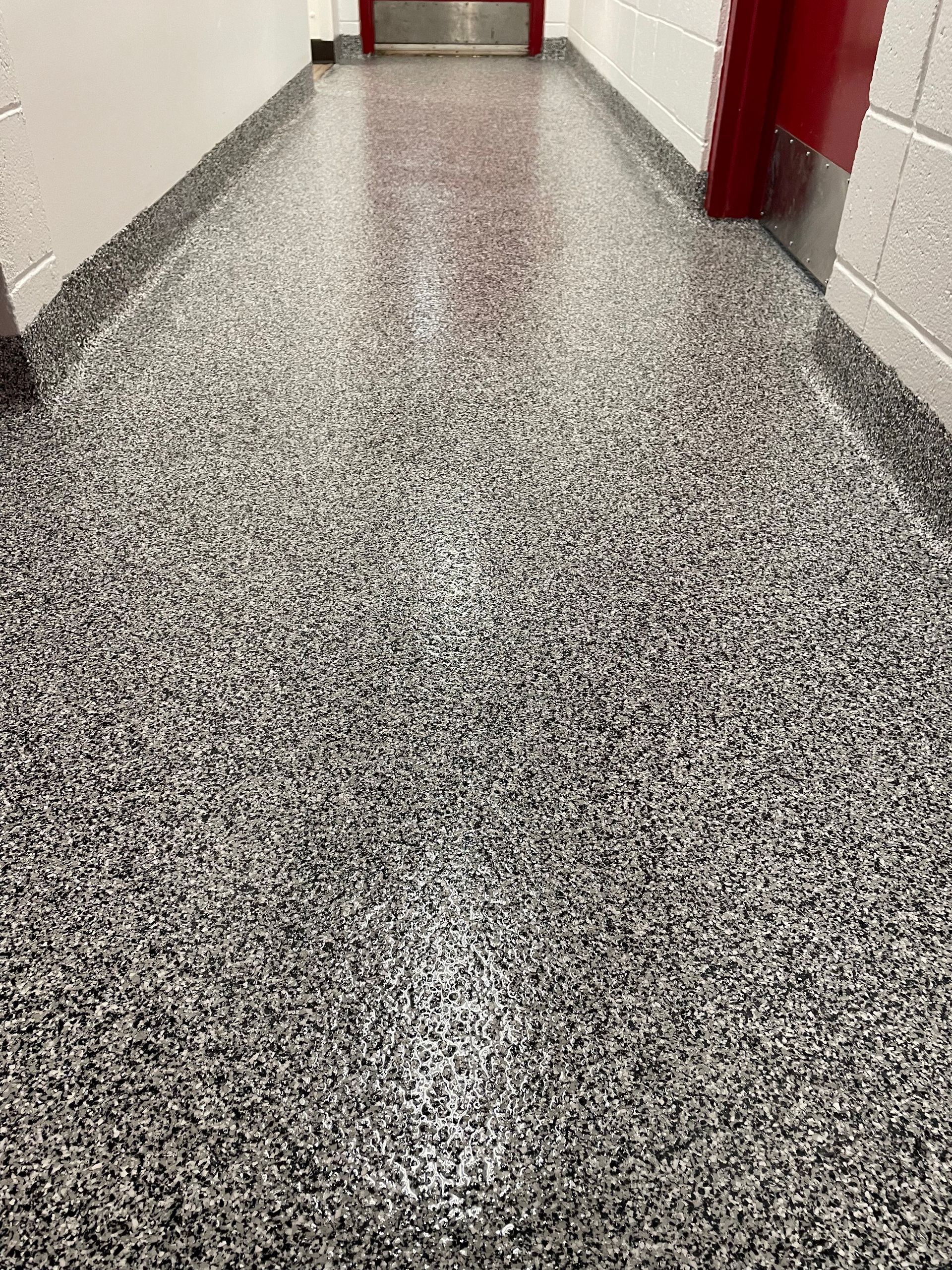 A close up of a painting of a river with a reflection of a mountain in the water.
