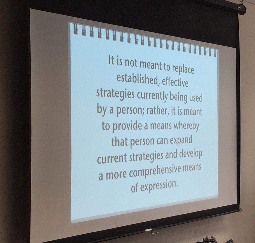 Projected slide: Text states new strategies expand current methods for more comprehensive expression.