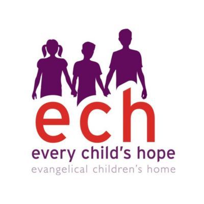 Logo: Purple silhouettes of three people holding hands above the red letters 