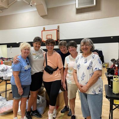 Members of Women with a Mission volunteer at Little Bit Foundation.