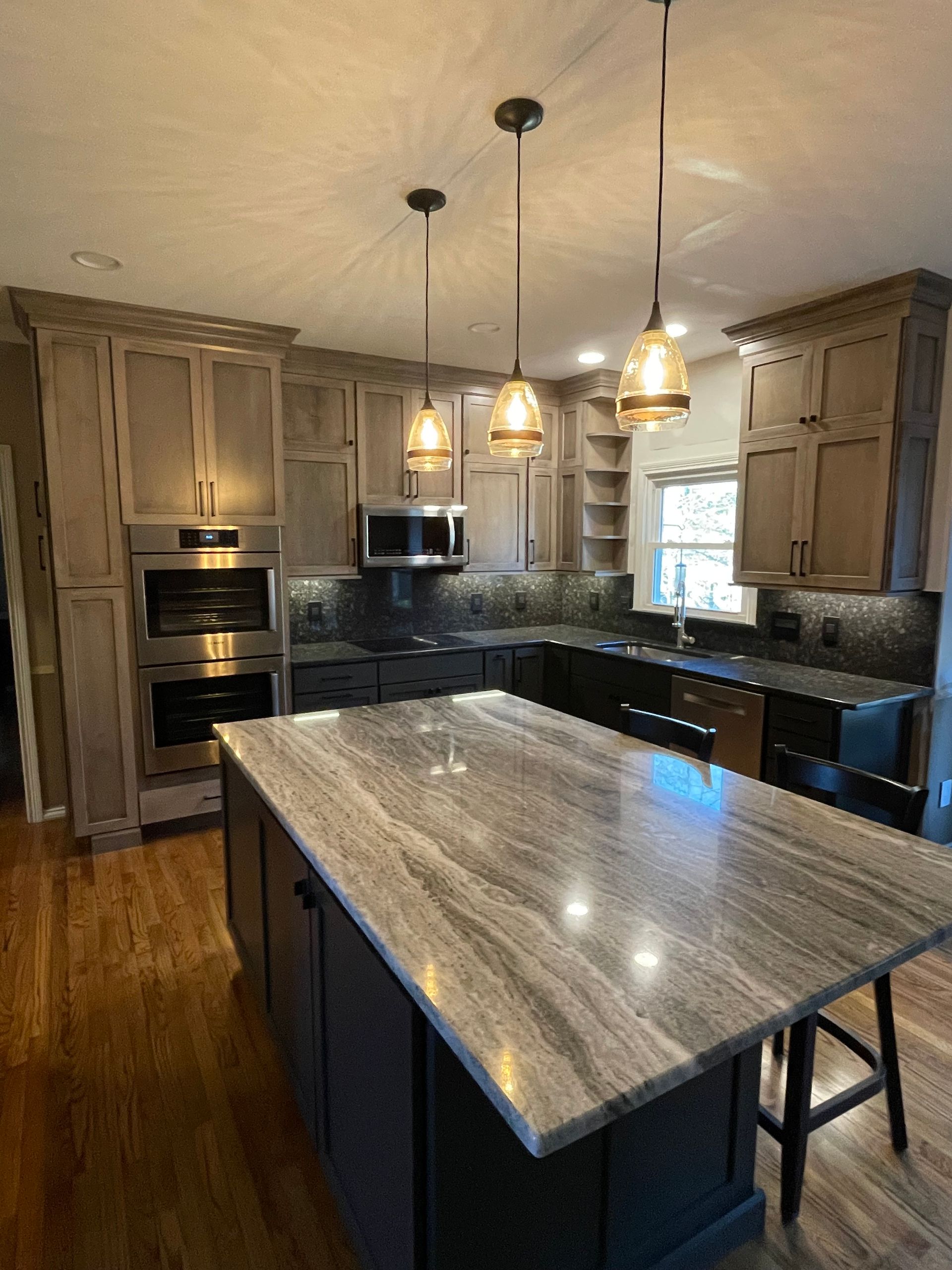 There is a large island in the middle of the kitchen.