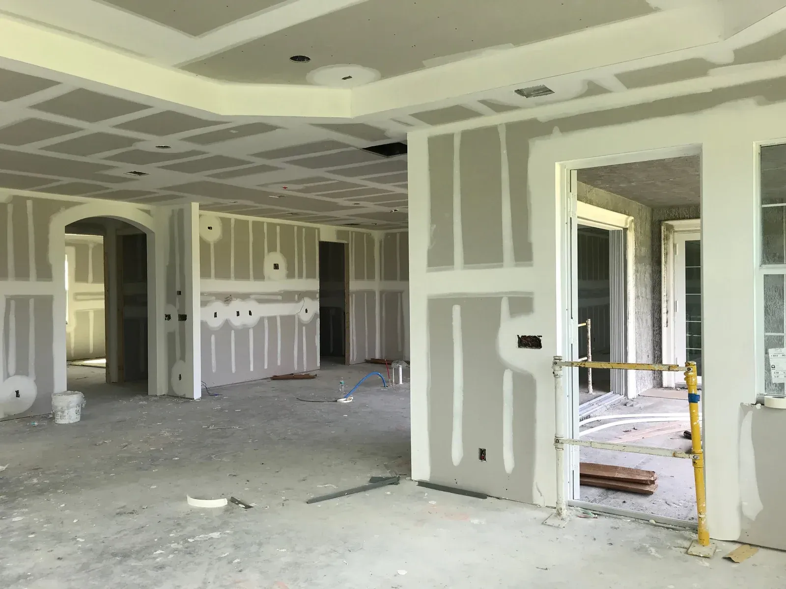 A large room with a lot of drywall on the walls and ceiling.