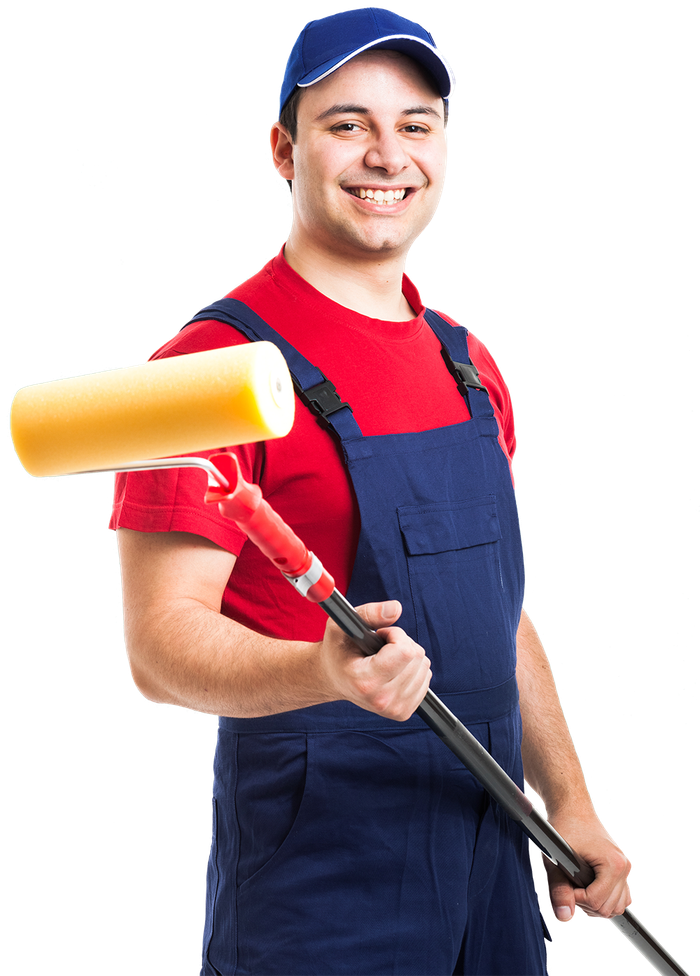 A man in overalls is holding a paint roller and smiling.