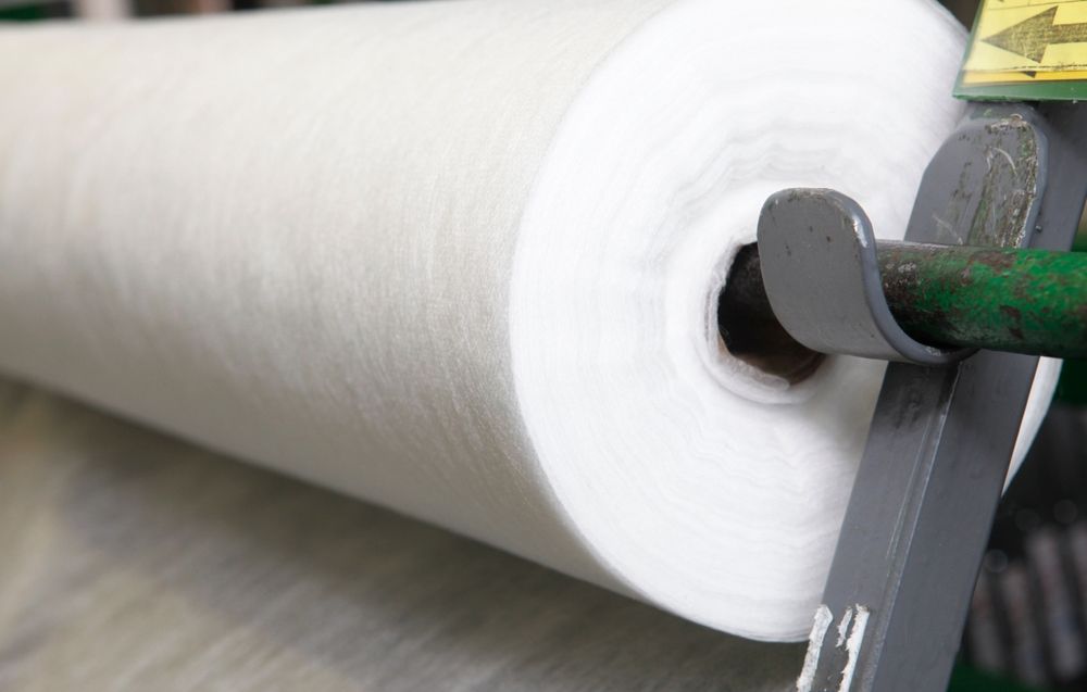 A roll of paper towels is sitting on top of a machine.