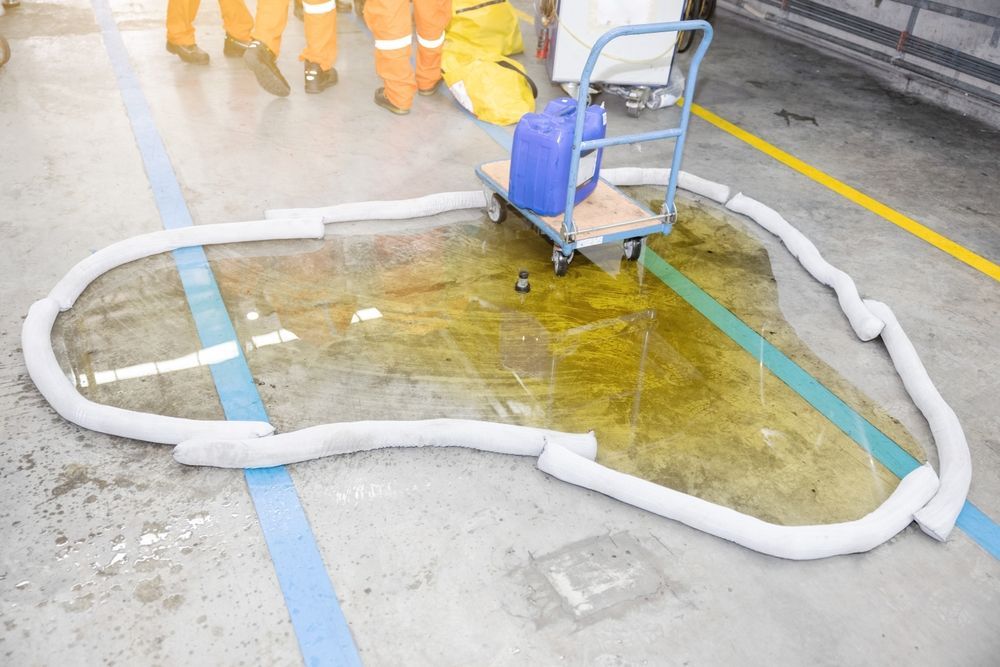 Workers are taking precautions for an industrial spill.