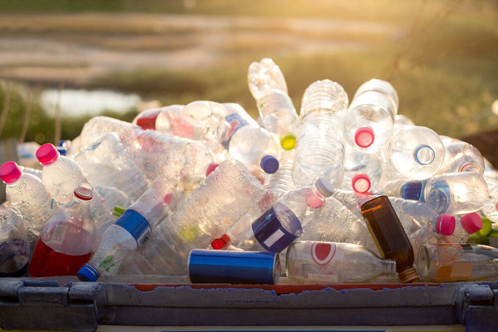 Pile of Plastic Bottles and Cans in a Trash Can — Rob's Rubbish Removal in Pottsville, NSW