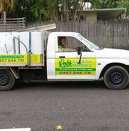 White Truck With a Yellow Sign on the Side is Parked on the Side of the Road — Rob's Rubbish Removal in Burleigh Heads, QLD