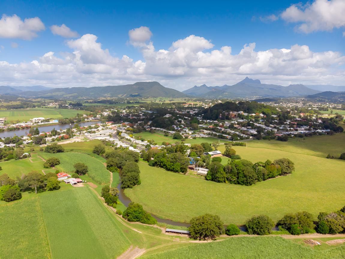 Aerial View of a Town Nestled in a Valley With Rolling Green Fields — Rob's Rubbish Removal in Murwillumbah, NSW