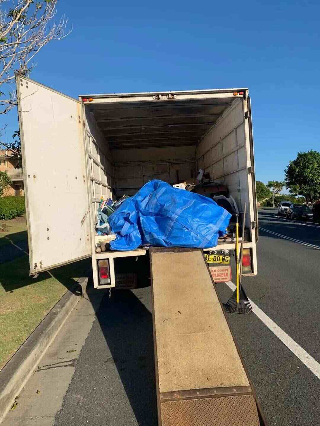Moving Truck is Parked on the Side of the Road Next to a Ramp — Rob's Rubbish Removal in Tweed Heads West, NSW