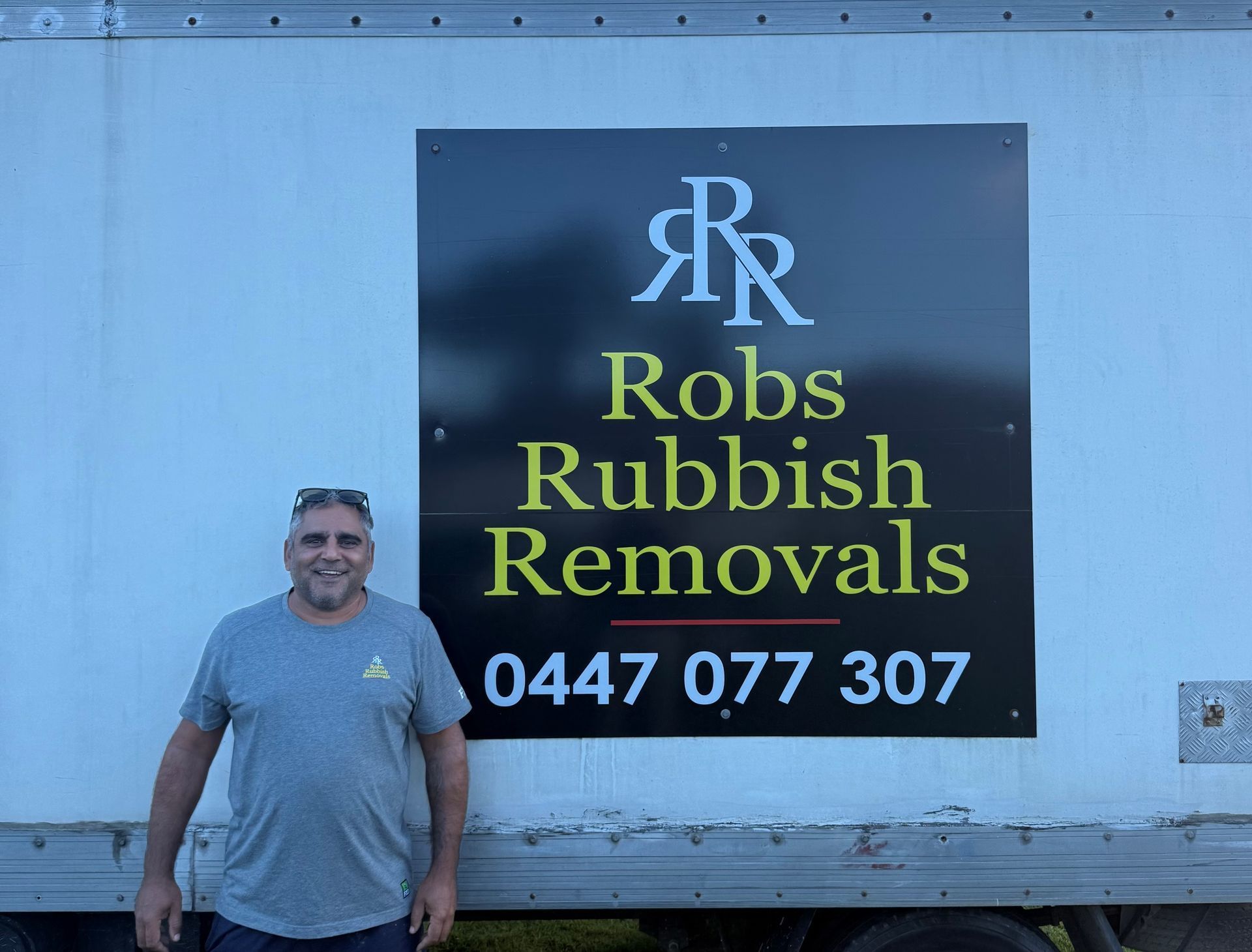 Man standing by a truck with a 