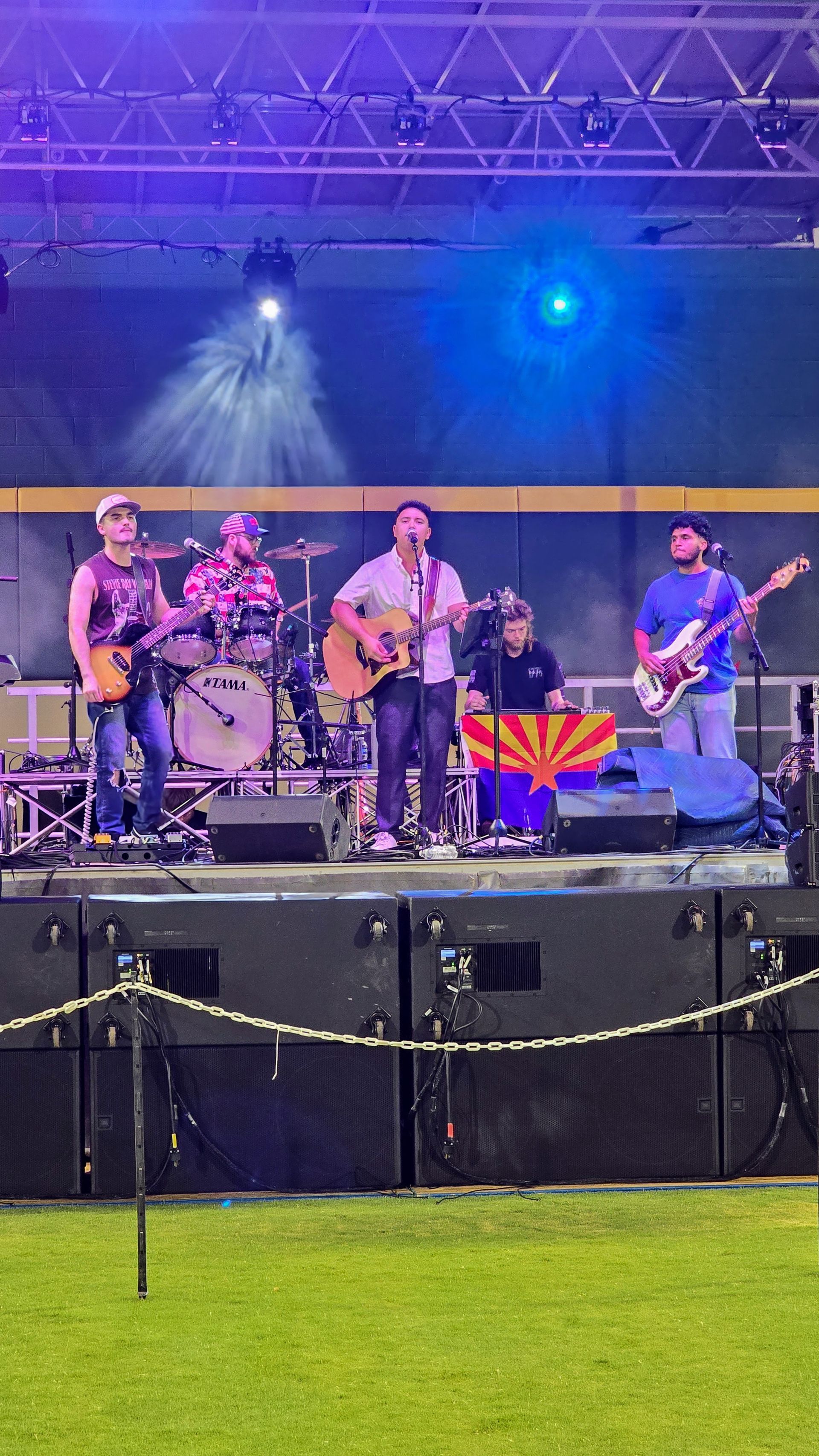 A group of people are playing instruments on a stage.