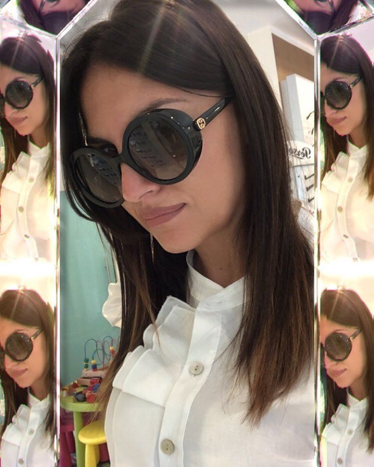 occhiali da sole con montatura tondeggiante