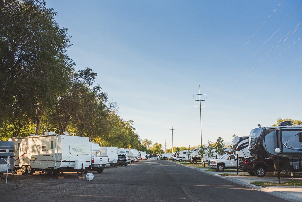 A row of rvs parked on the side of a road.