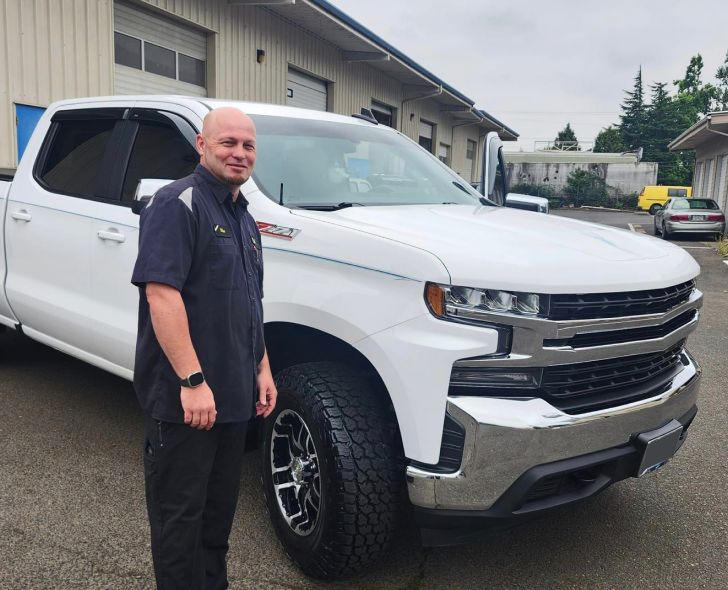 Man standing in front of a car | Oakmont Service Center