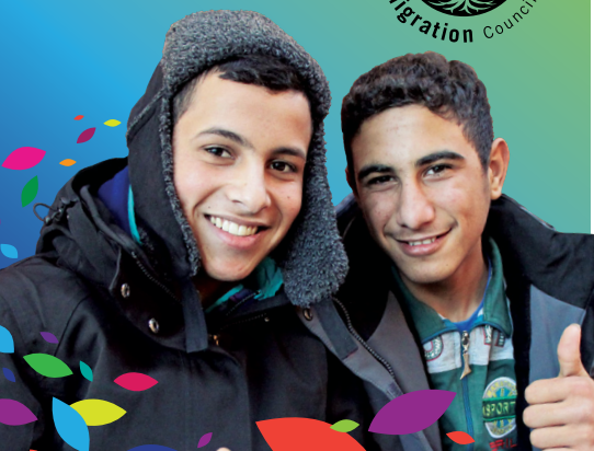 Two young men are standing next to each other with the word migration on the bottom