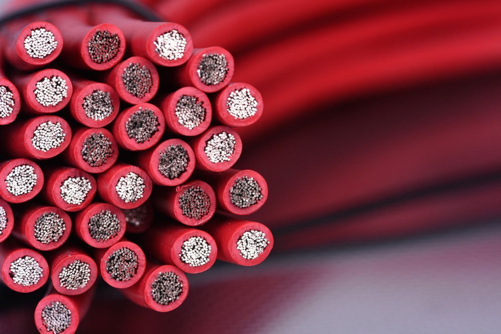A Bunch of Red Wires Are Stacked on Top of Each Other — East-West Fire Services In Garbutt, QLD