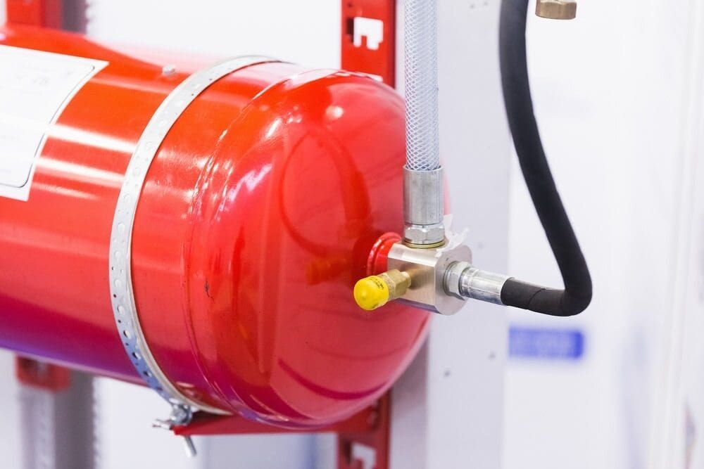 A Close Up of a Fire Extinguisher With a Hose Attached to It — East-West Fire Services In Hughenden, QLD